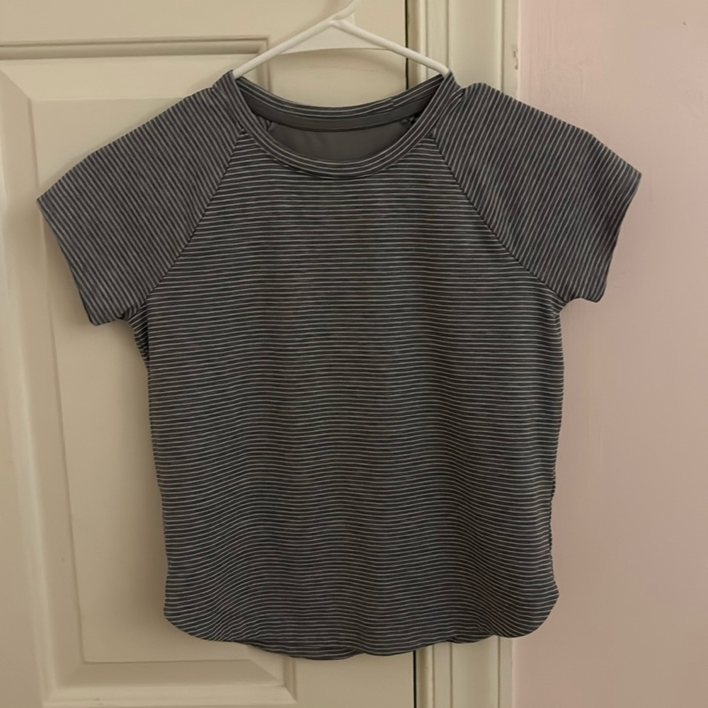 Athletic girl, gray and white striped top